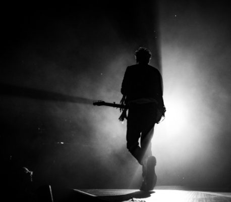guitarist on stage in greyscale