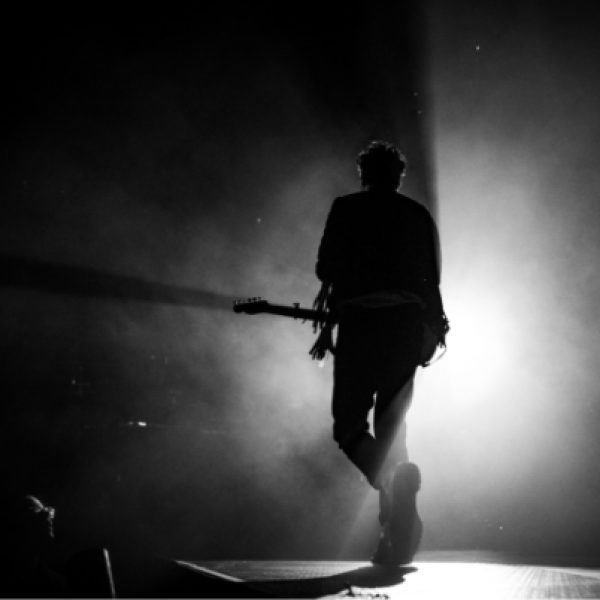 guitarist on stage in greyscale